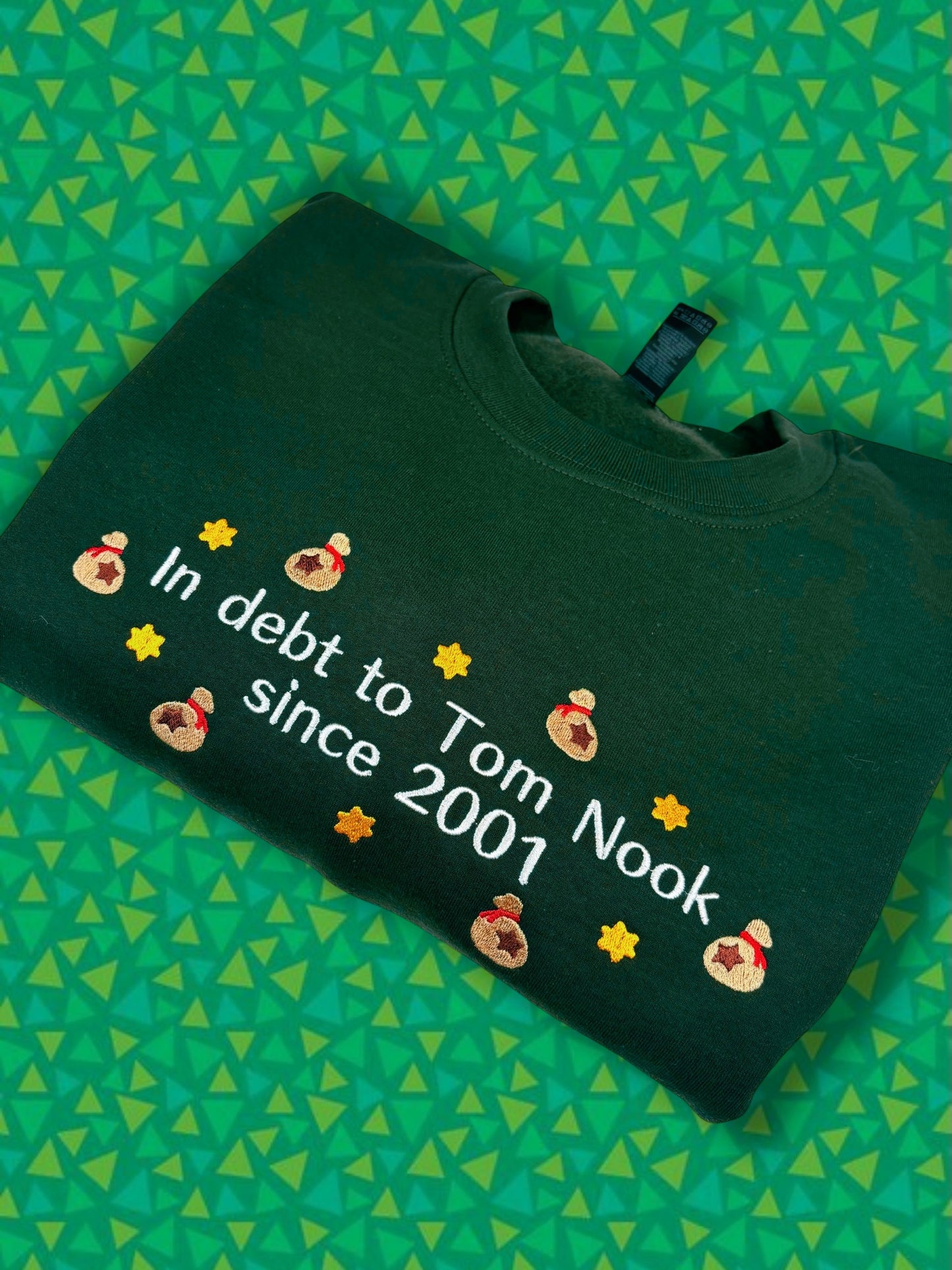 In Debt To Tom Nook Since 2001 embroidered sweatshirt