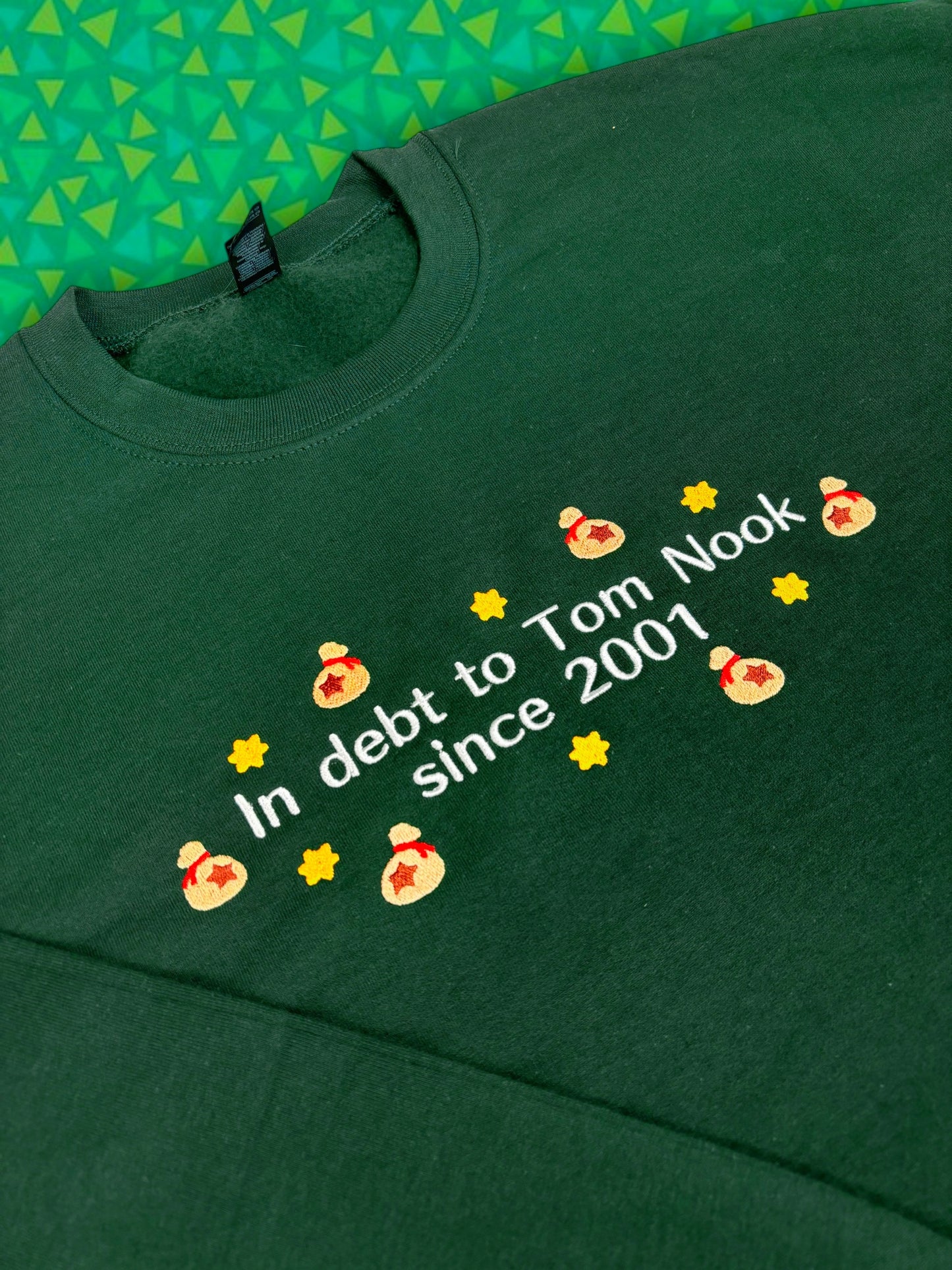 In Debt To Tom Nook Since 2001 embroidered sweatshirt