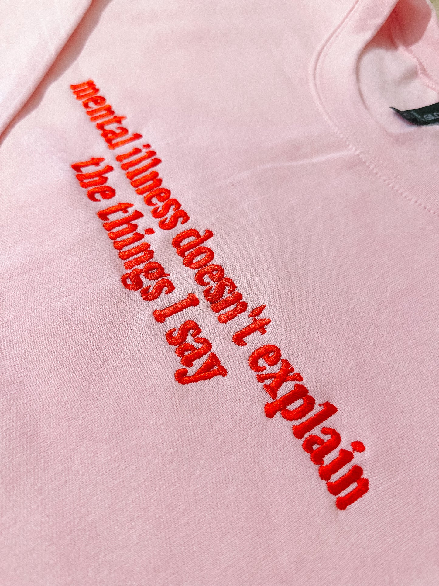 Mental Illness Doesn’t Explain The Things I Say embroidered sweatshirt