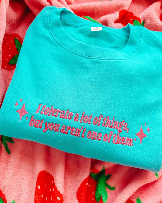 I Tolerate A Lot Of Things, But You Aren't One Of Them embroidered crewneck sweatshirt