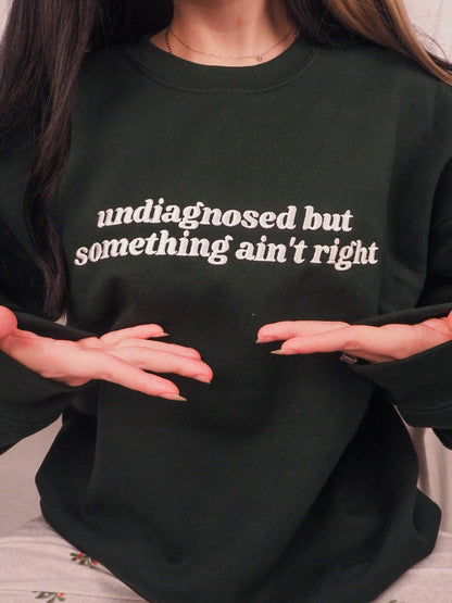 Undiagnosed But Something Ain’t Right embroidered crewneck sweatshirt