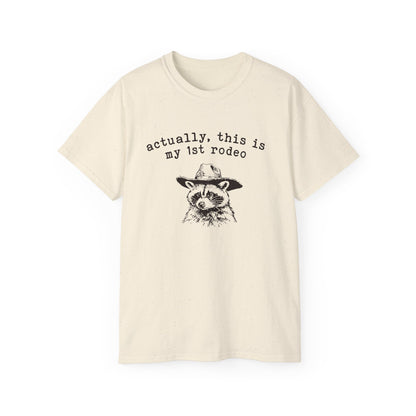A natural t-shirt with a raccoon printed on it